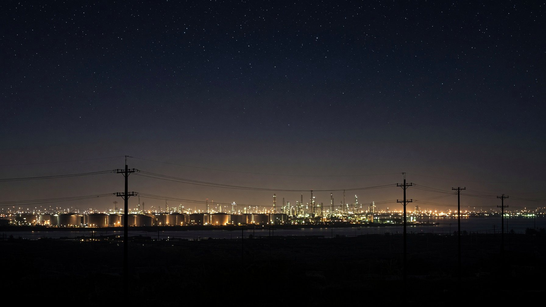 Night tank farm, stars, poles