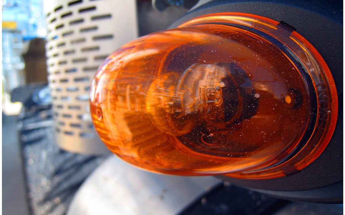 Amber lamp on the side of a tractor trailer rig located near Baytown, Texas.
