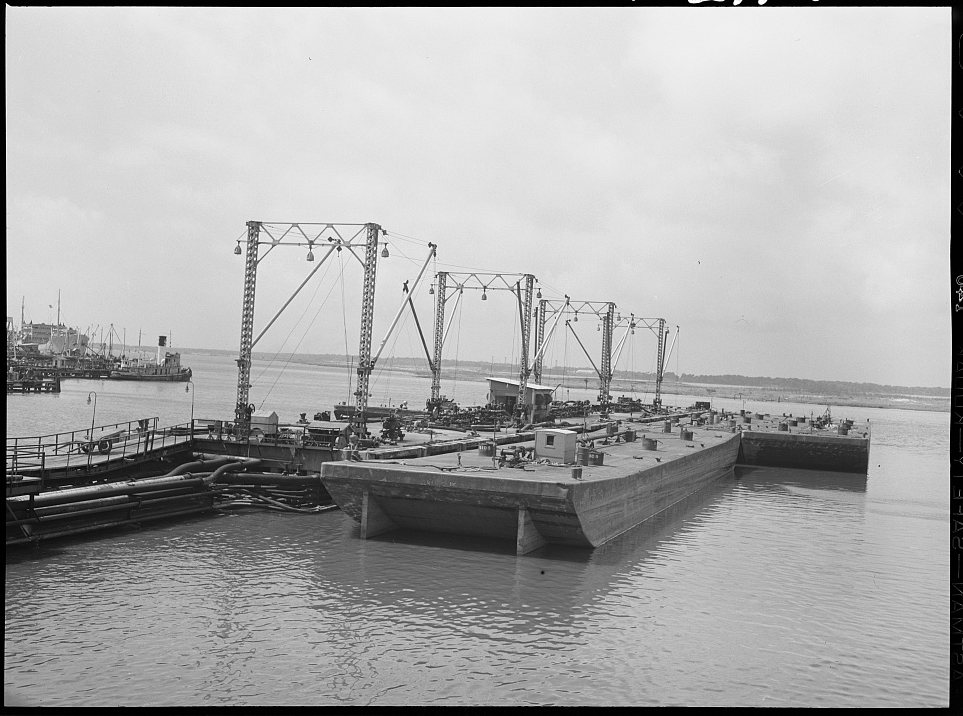 Barges loading oil at a refinery. Baytown, Texas