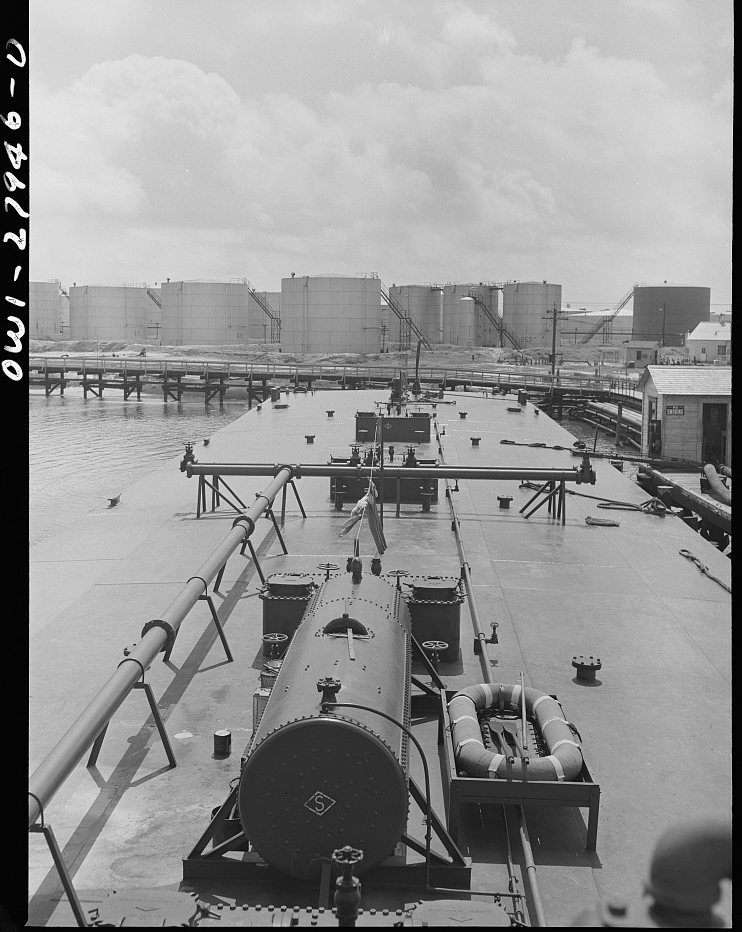 Baytown, Texas. Barge at a refinery to be loaded with oil