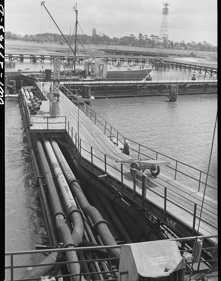Baytown, Texas. Pipelines leading to a barge loading dock at a refinery