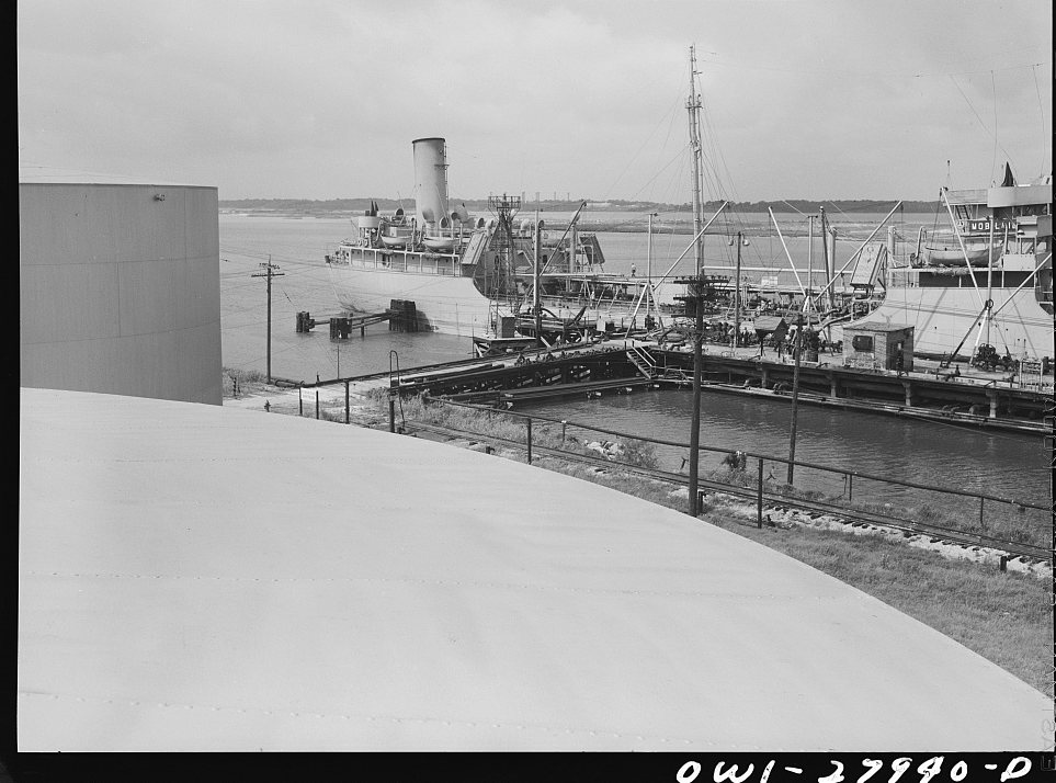 Tanker which is being loaded with oil at a refinery. Baytown, Texas
