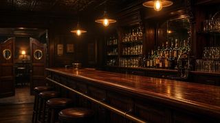 an empty bar counter with stools